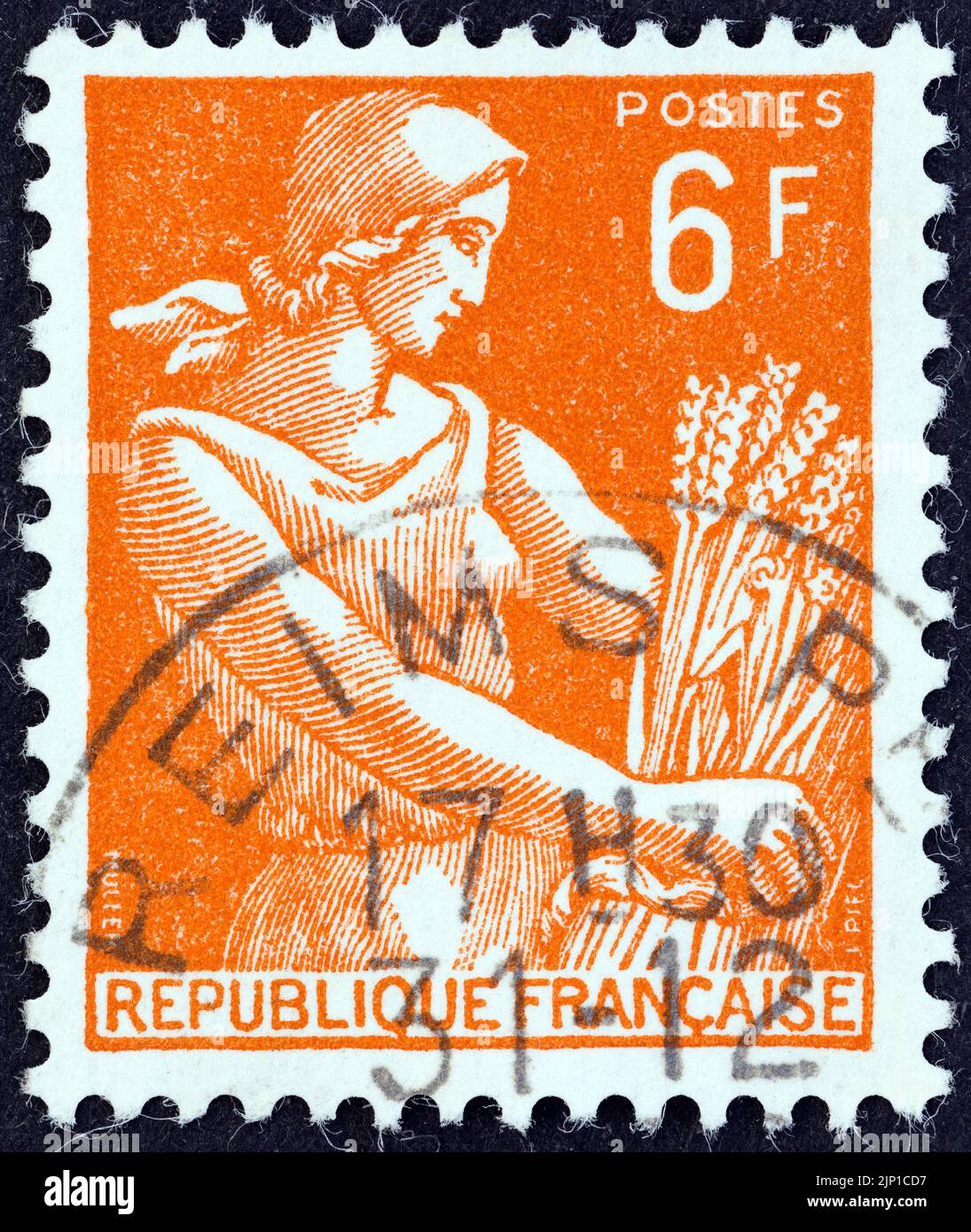 FRANCE - CIRCA 1954: A stamp printed in France shows Harvester, circa 1954. Stock Photo