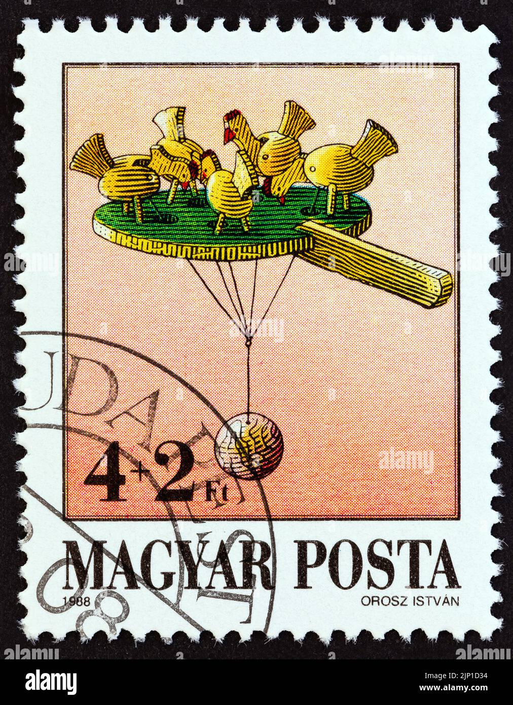 HUNGARY - CIRCA 1988: A stamp printed in Hungary from the 'Exhibits in Toy Museum, Kecskemet' issue shows Pecking chicks, circa 1988. Stock Photo
