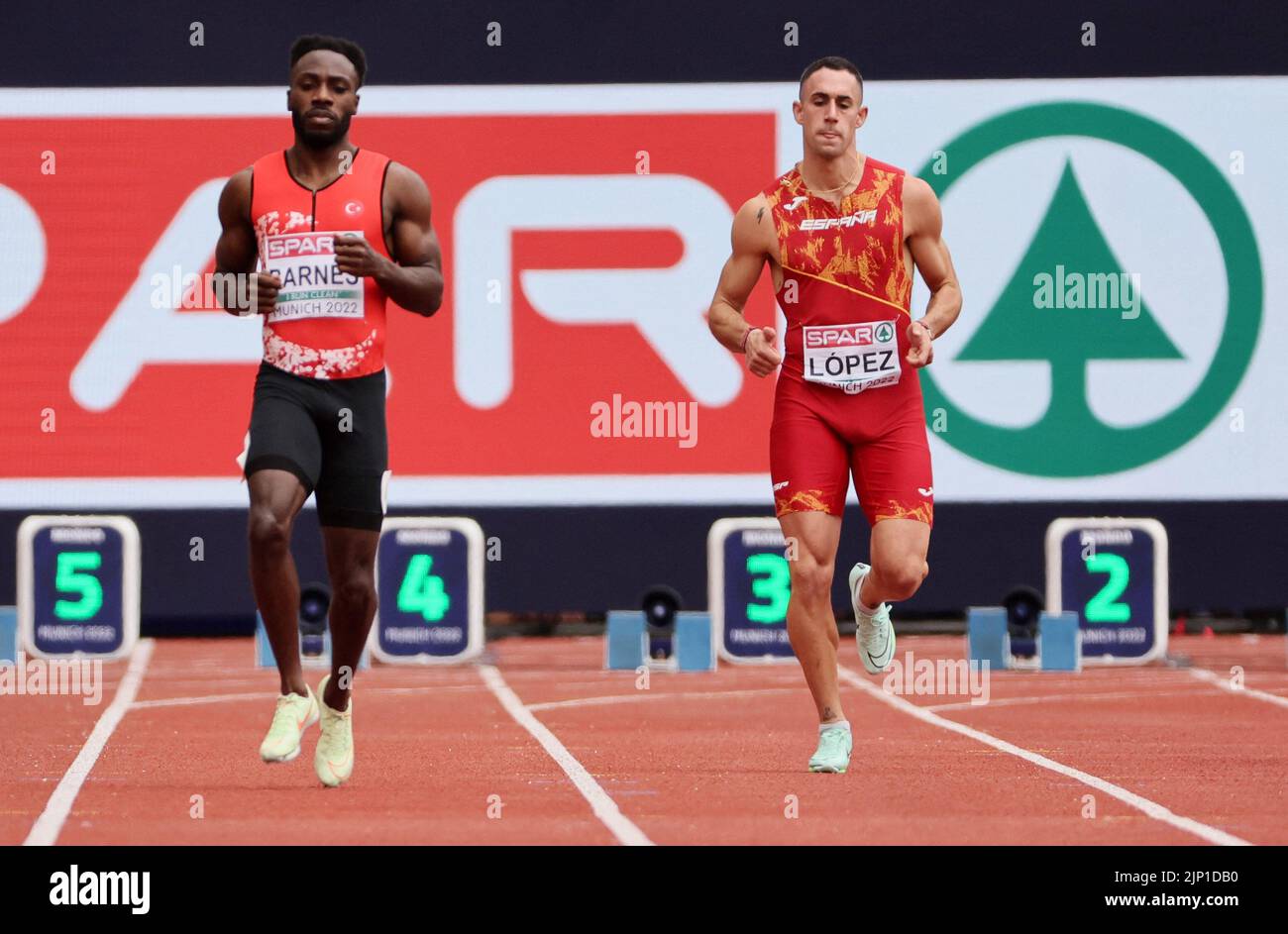 Athletics - 2022 European Championships - Olympiastadion, Munich, Germany - August 15, 2022 Spain's Sergio Lopez is seen with Turkey's Emre Zafer Barnes before been disqualified on the Men's Decathlon 100m - Heats REUTERS/Wolfgang Rattay Stock Photo