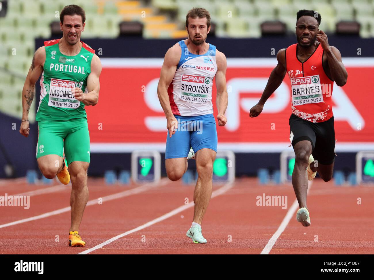 Athletics - 2022 European Championships - Olympiastadion, Munich, Germany - August 15, 2022 Portugal's Carlos Nascimento, Czech Republic's Zdenek Stromsik and Turkey's Emre Zafer Barnes in action during the Men's Decathlon 100m - Heats REUTERS/Wolfgang Rattay Stock Photo