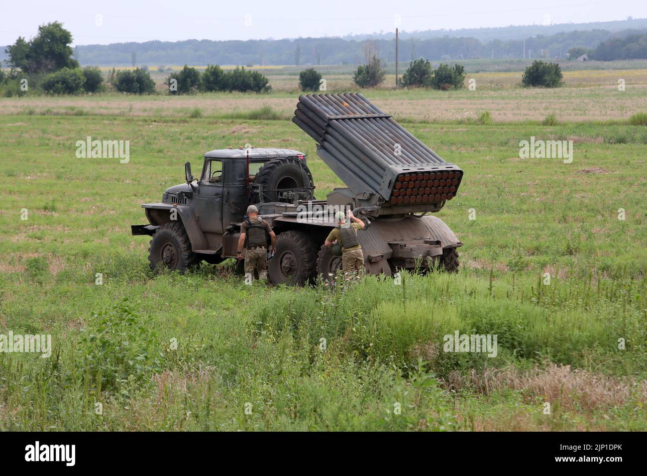 UKRAINE - AUGUST 12, 2022 - Servicemen of Ukraine's Armed Forces employ a BM-21 Grad multiple rocket launcher to perform precision attacks on Russian Stock Photo