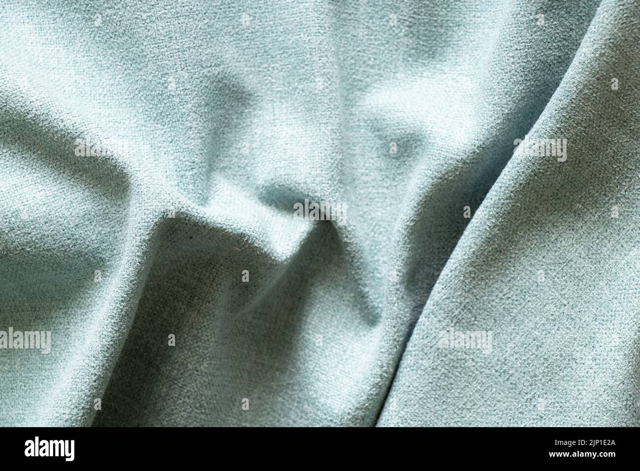 Light blue wrinkled fabric for the background, fabric for the background macro photo Stock Photo