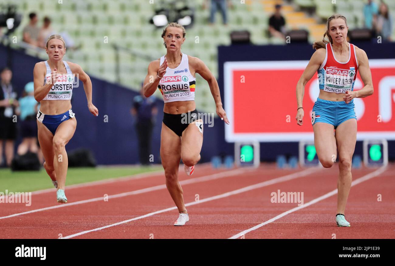 Athletics - 2022 European Championships - Olympiastadion, Munich, Germany - August 15, 2022 Belgium's Rani Rosius and Luxembourg's Patrizia Van Der Weken in action during the Women's 100m Round 1 - Heats REUTERS/Wolfgang Rattay Stock Photo