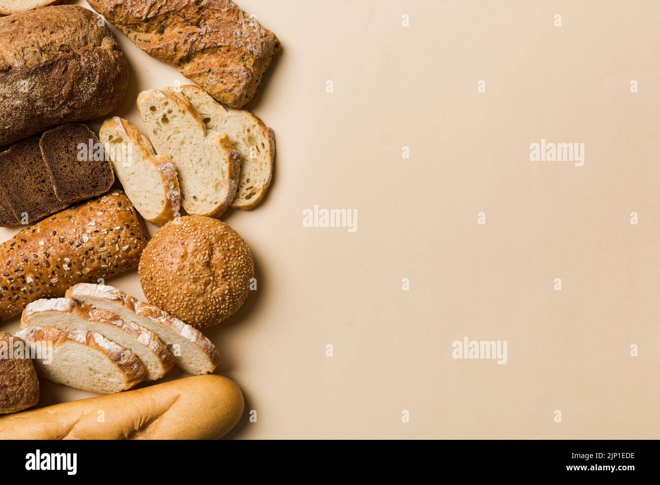 Homemade natural breads. Different kinds of fresh bread as background, top view with copy space