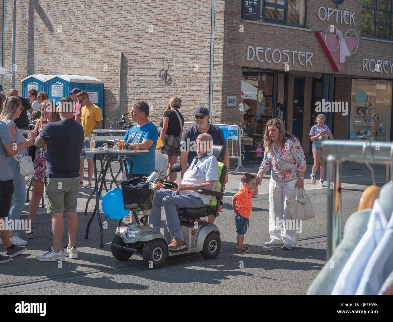 Sint Gillis Waas, Belgium 06 August 2022, older happy gray man in his scoot mobile Stock Photo