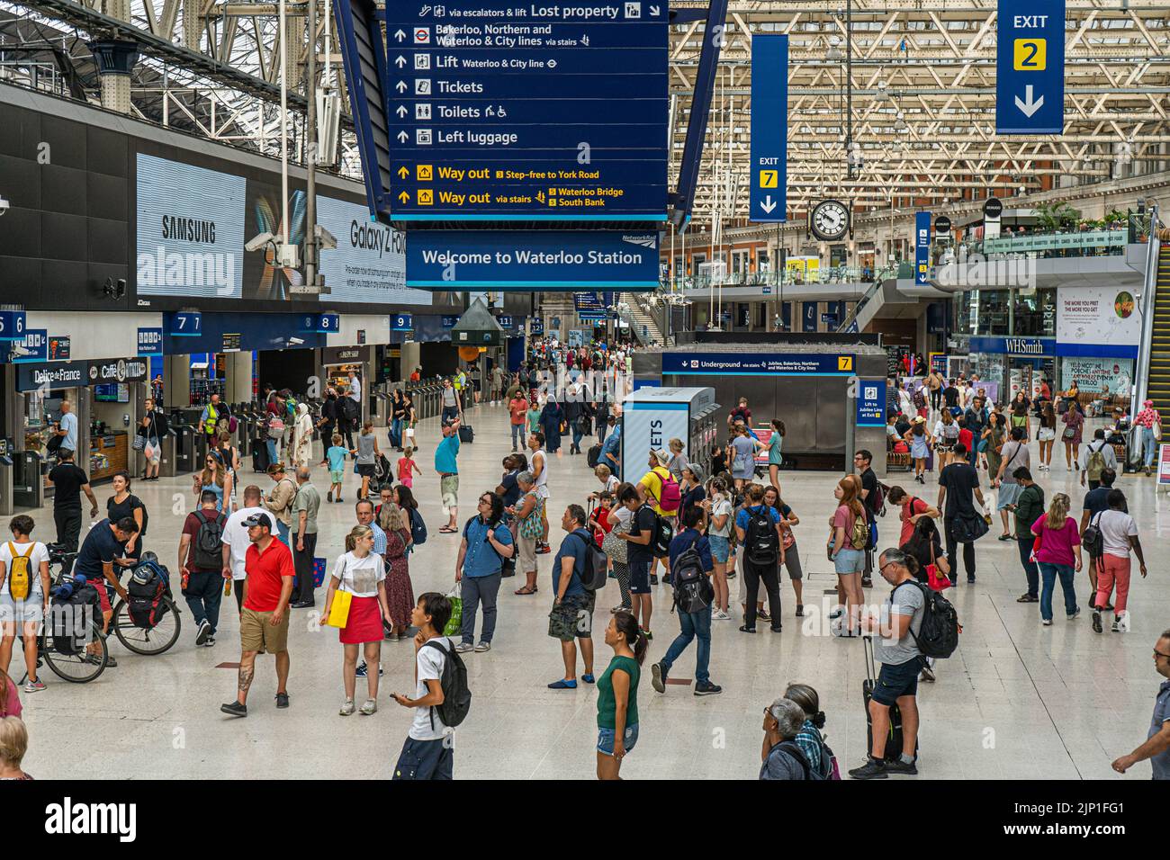 Waterloo London, UK. 15 August 2022 . Commuters walk past a sign announcing strike action at a busy Waterloo station on Monday morning. The Rail, Maritime and Transport Workers (RMT) union has announced strike action from Thursday 18- 21 August in a walkout by train drivers who are demanding an increase in pay in line with the current inflation of 15 per cent. Passengers have been advised not to travel  on those days due to severe disruption Credit. amer ghazzal/Alamy Live News Stock Photo