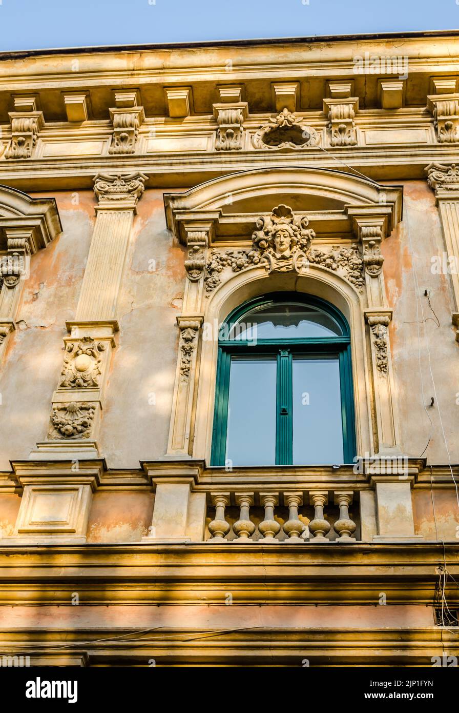 Pecs, Hungary - October 06, 2018: Windows with decorative baroque facades in the center of Pecs, Hungary Stock Photo