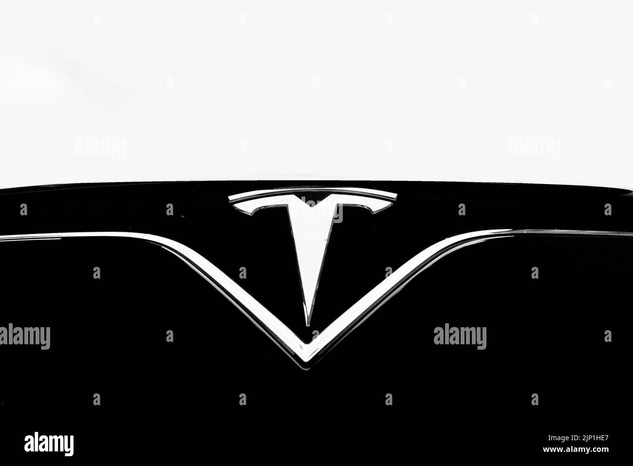 A Tesla logo on a Model X car Stock Photo