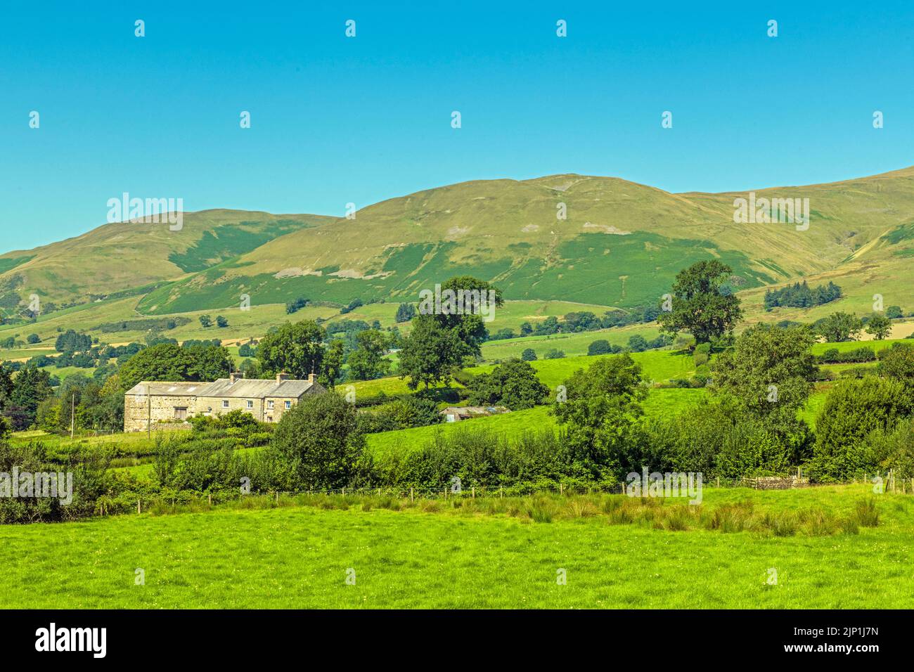 A view of Winder on the left, and Crook to the centre, overlooking the rural town of Sedbergh in Cumbria Stock Photo