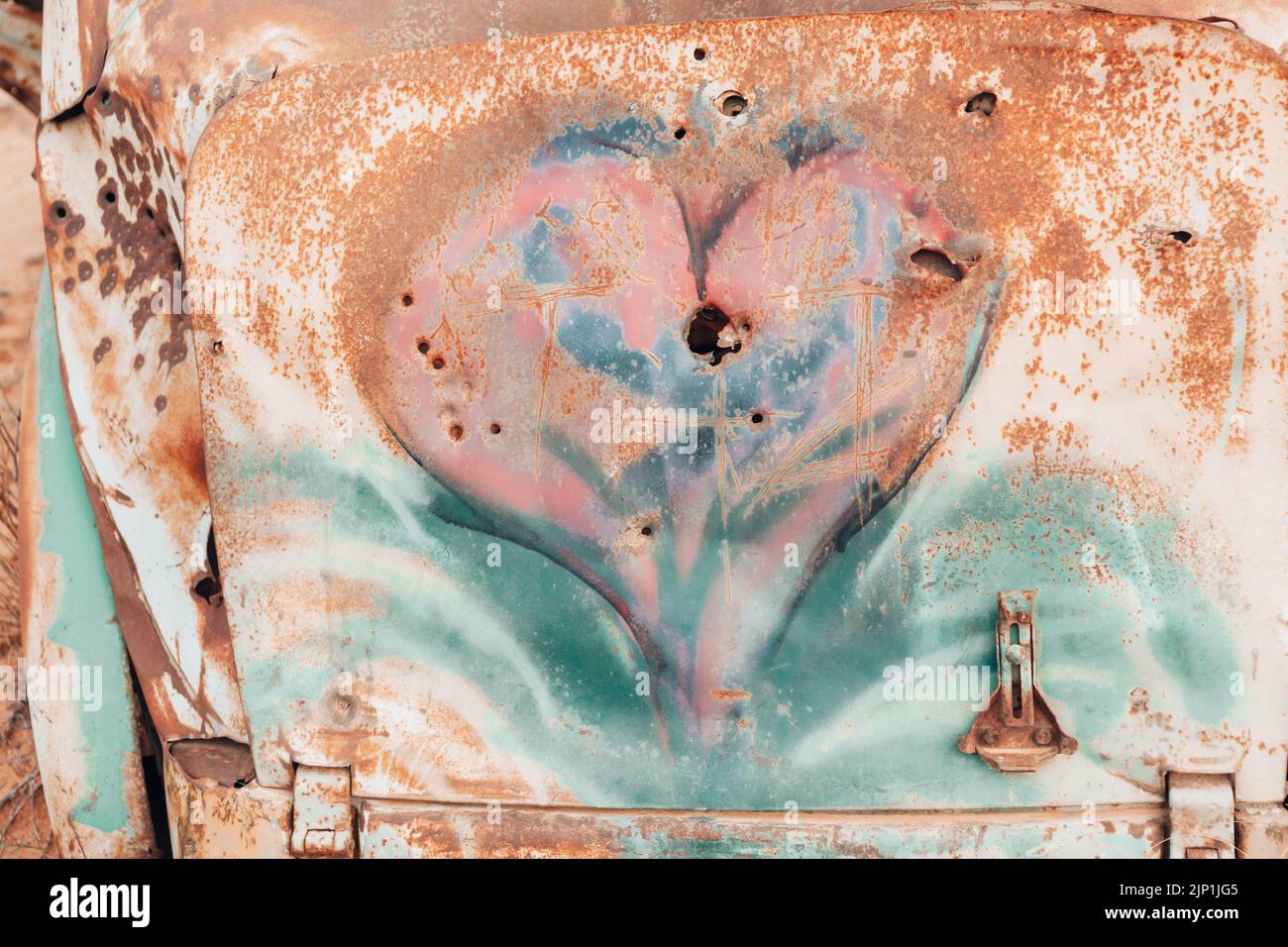 Rust Haert Rusted heart with hit with bullet holes abstract Stock Photo - Alamy