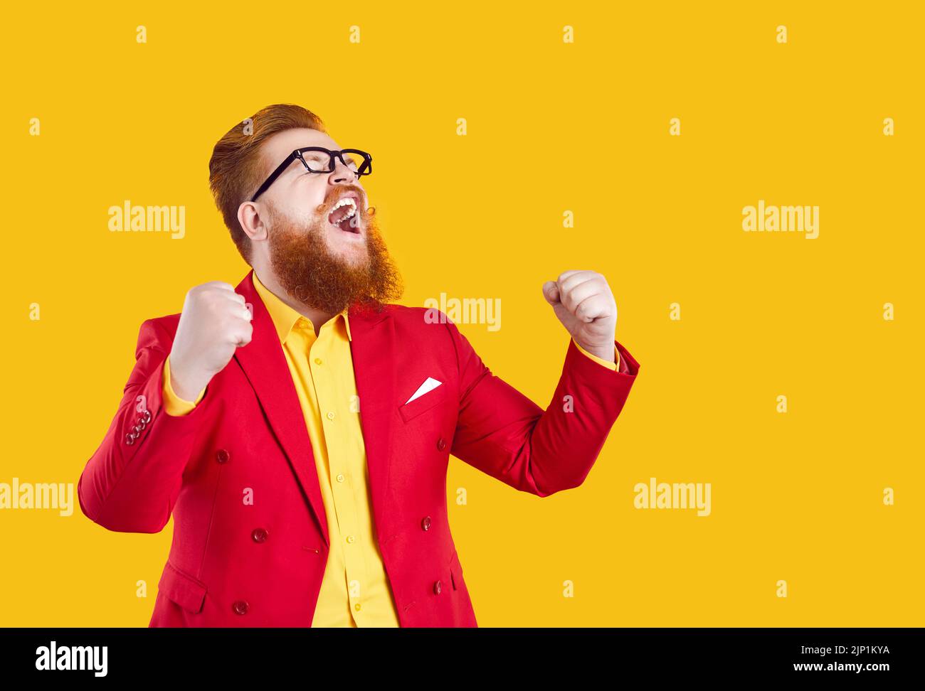 Crazy happy stylish bearded chubby man laughing out loud rejoicing in his success. Stock Photo
