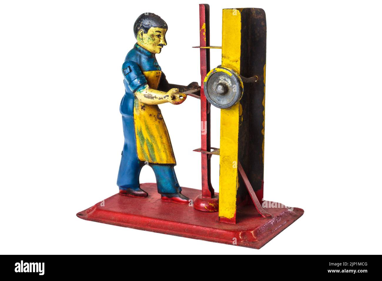 Vintage metal toy of a factory worker isolated on a white background Stock Photo