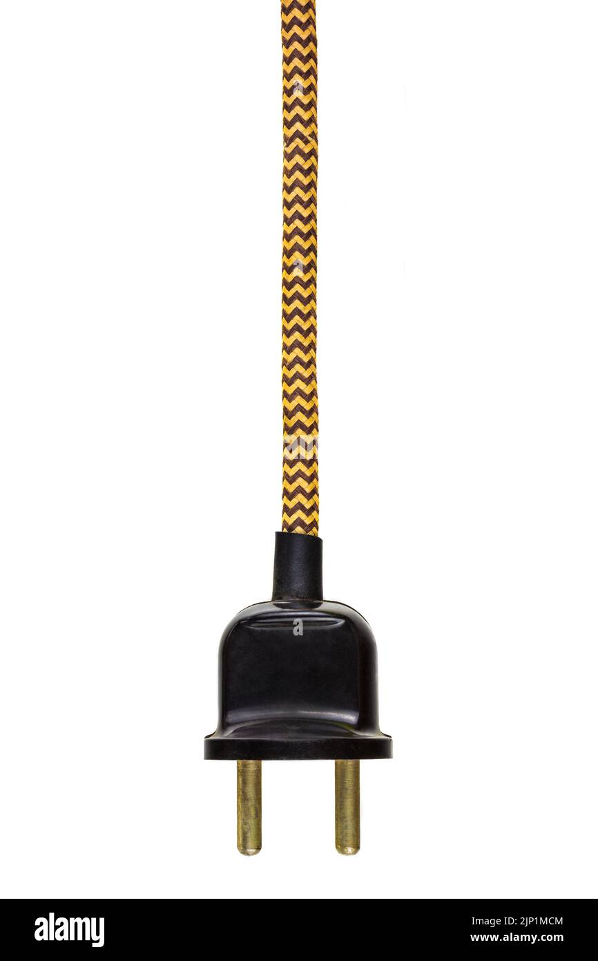 Vintage black power plug with yellow cord isolated on a white background Stock Photo