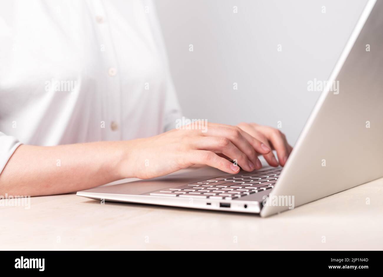 Woman hands closeup typing on laptop keyboard. Using computer for work ...