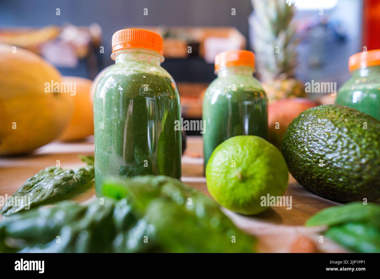 Healthy protein shake on table with fruits and vegetables ingredients