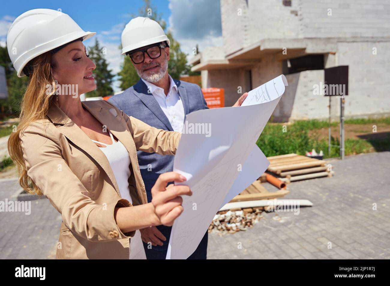 Real estate agent shows house project to client Stock Photo Alamy