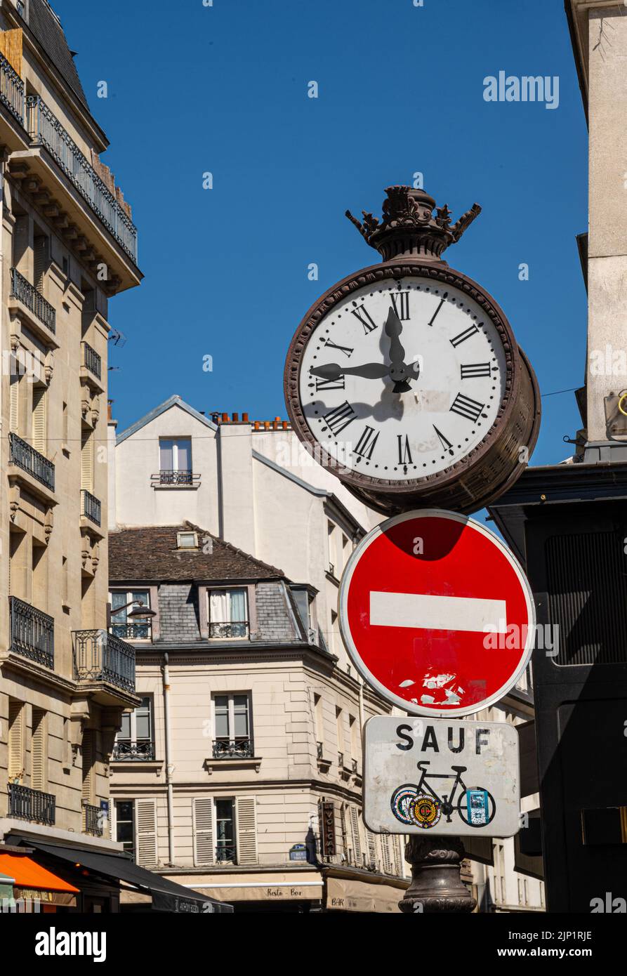 clock in rue mouffetard, paris, france Stock Photo