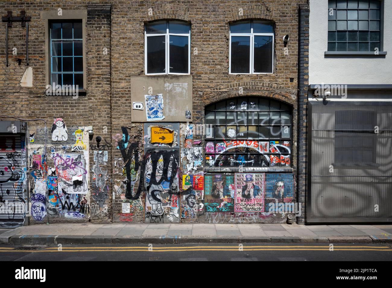 Grafitti on a wall in the Brick Lane area of London UK Stock Photo