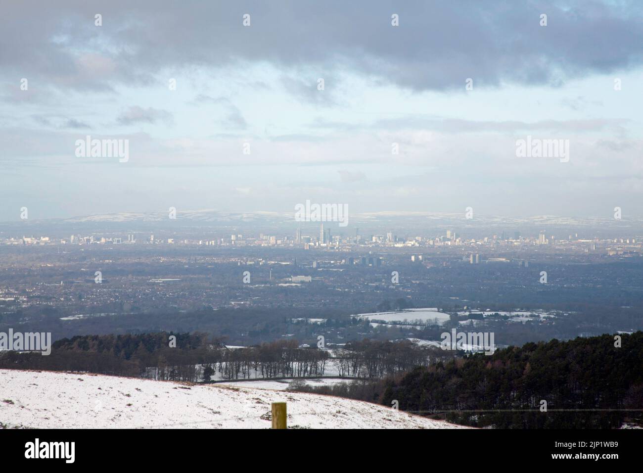 A winter view of Manchester seen from near Bowstonegate above Lyme Park Cheshire England Stock Photo