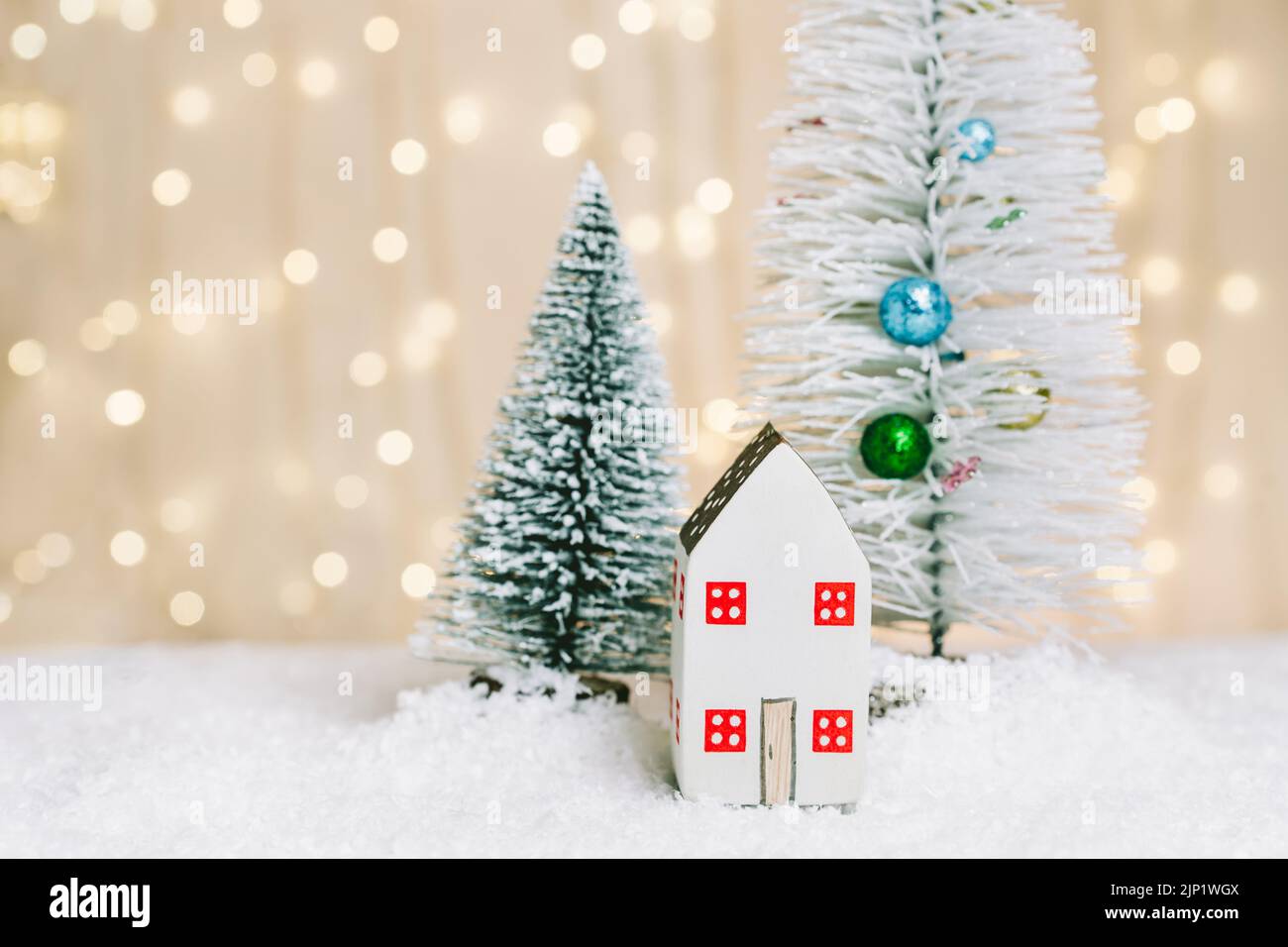 Christmas and New Year miniature house with decorated festive trees in ...