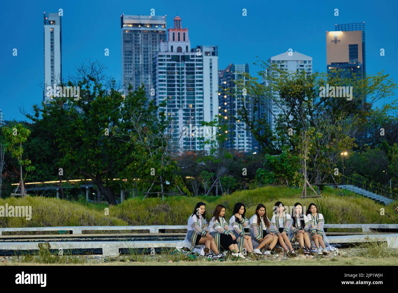 BANGKOK, THAILAND - 23 MARCH 2022 : Student girls are posing in the Benchakitti Forest Park in the city center . Stock Photo