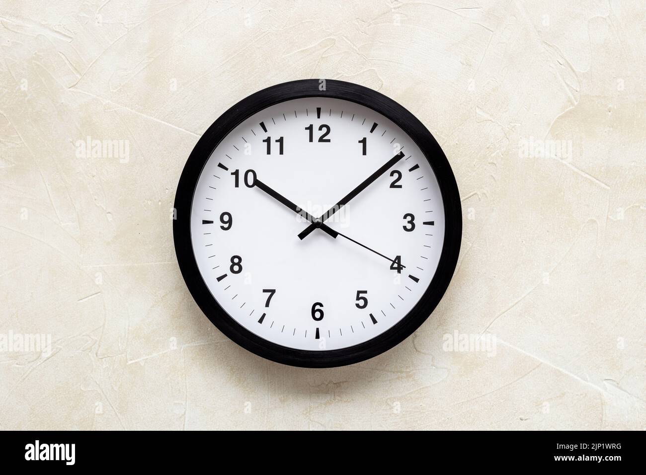 Round wall black and white clock. Time to work or rest concept Stock Photo Alamy