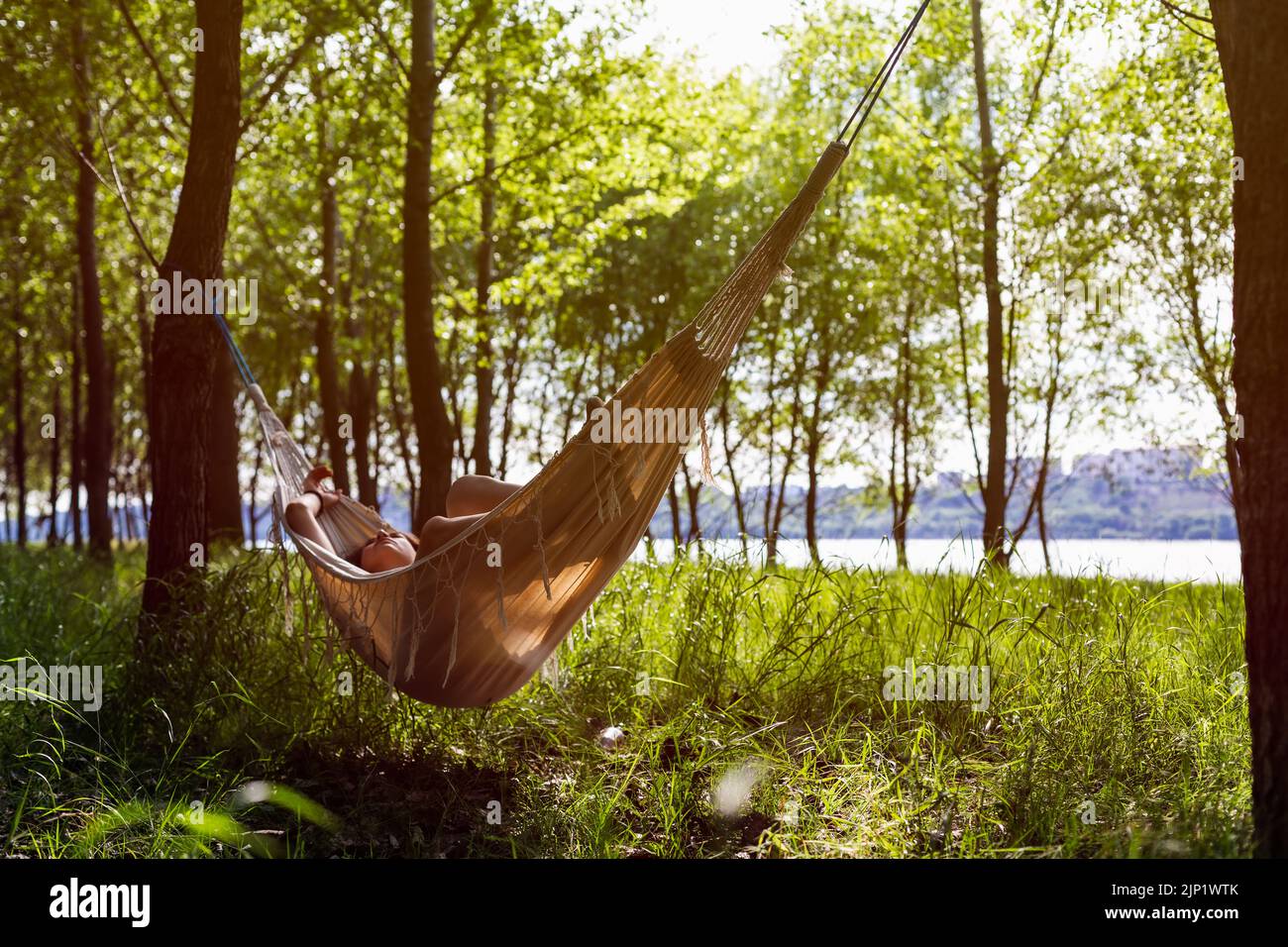 Women in hammock relaxing on the forest Stock Photo