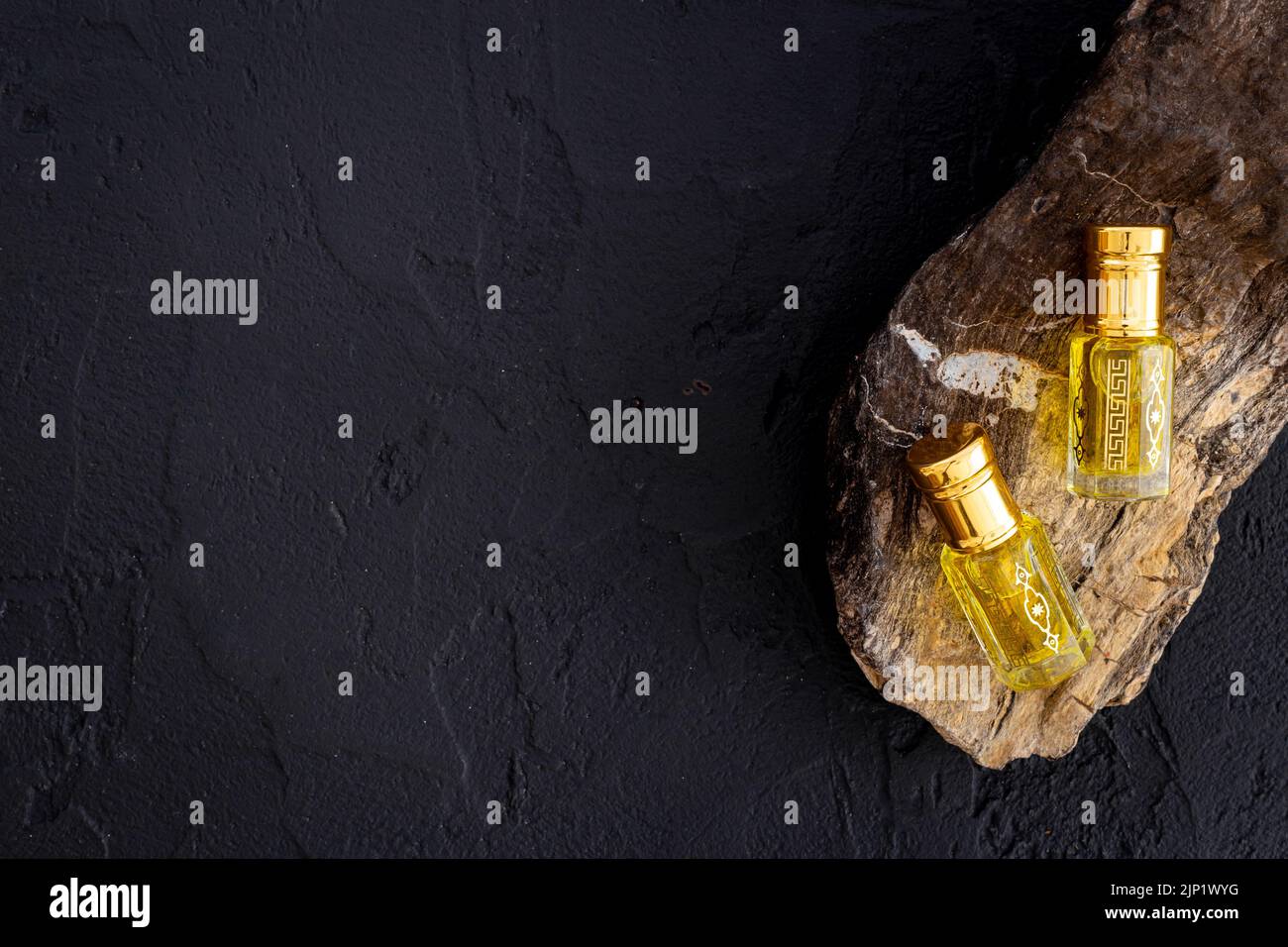 Arabian oud attar oil perfume in glass bottles. Overhead view Stock