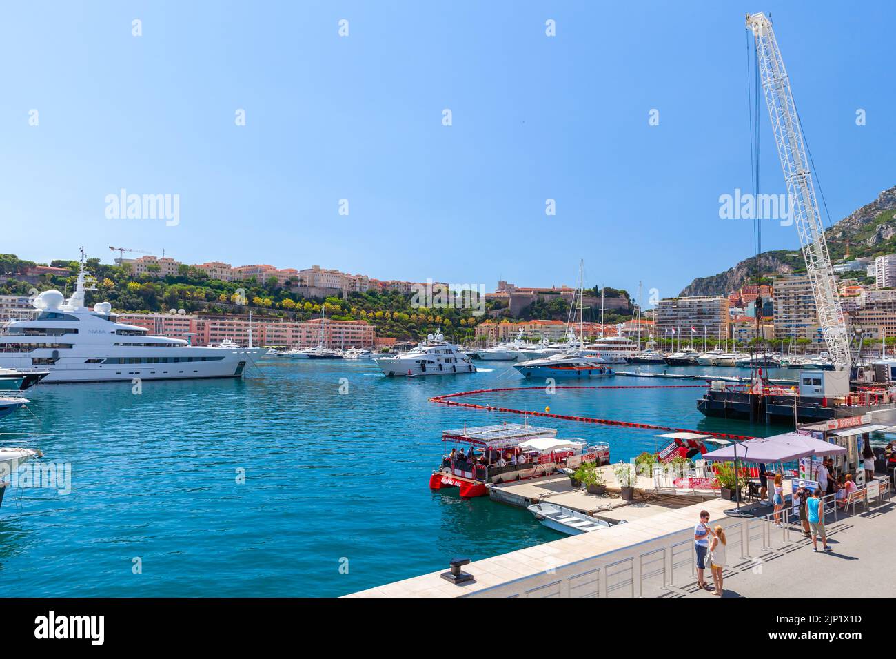 Monte Carlo, Monaco - August 15, 2018: Tourists wait for water bus boarding in Port Hercule of Monte Carlo Stock Photo