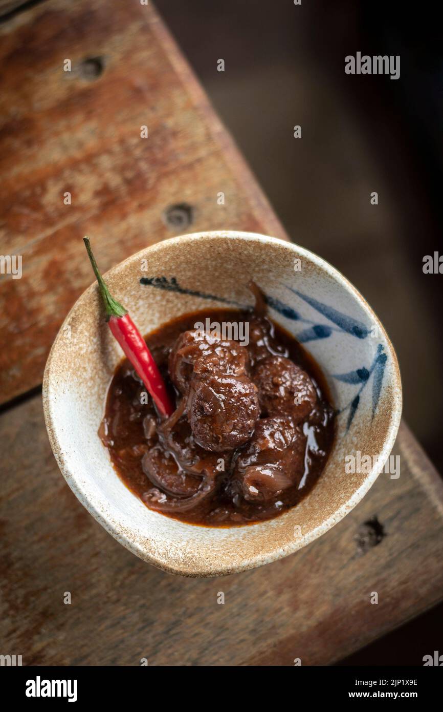 spicy chilli chorizo sausage in red wine escabeche sauce tapas Stock Photo Alamy