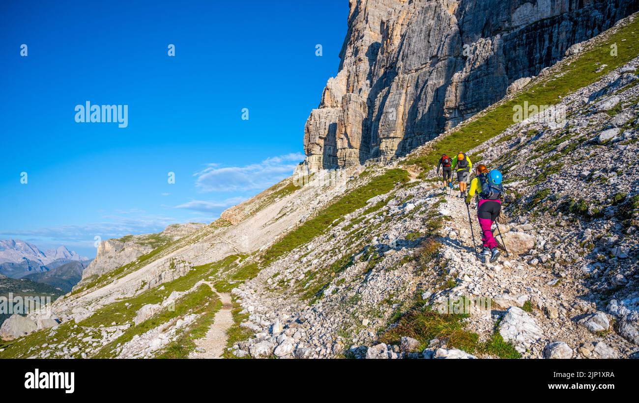 Group of hikers ascending the mountain in Dolomites Stock Photo - Alamy