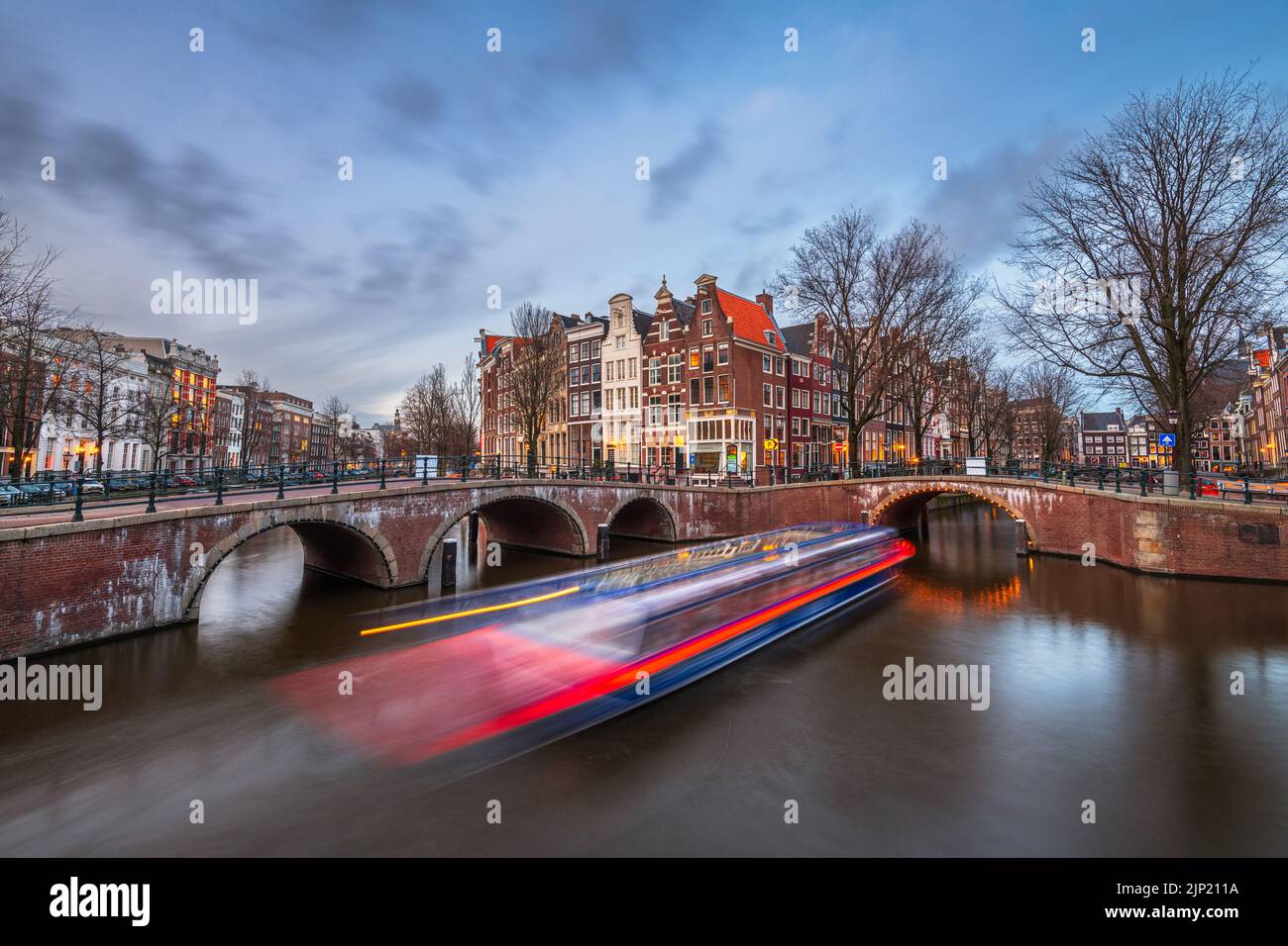Amsterdam, Netherlands from the famous bridges and canals at twilight. Stock Photo
