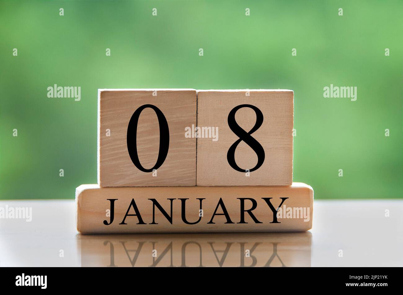 January 8 calendar date text on wooden blocks with blurred background ...