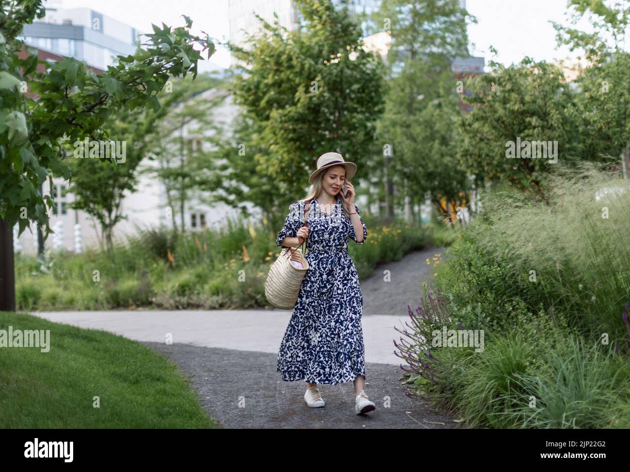 Mature woman alone walking park hi-res stock photography and images - Alamy