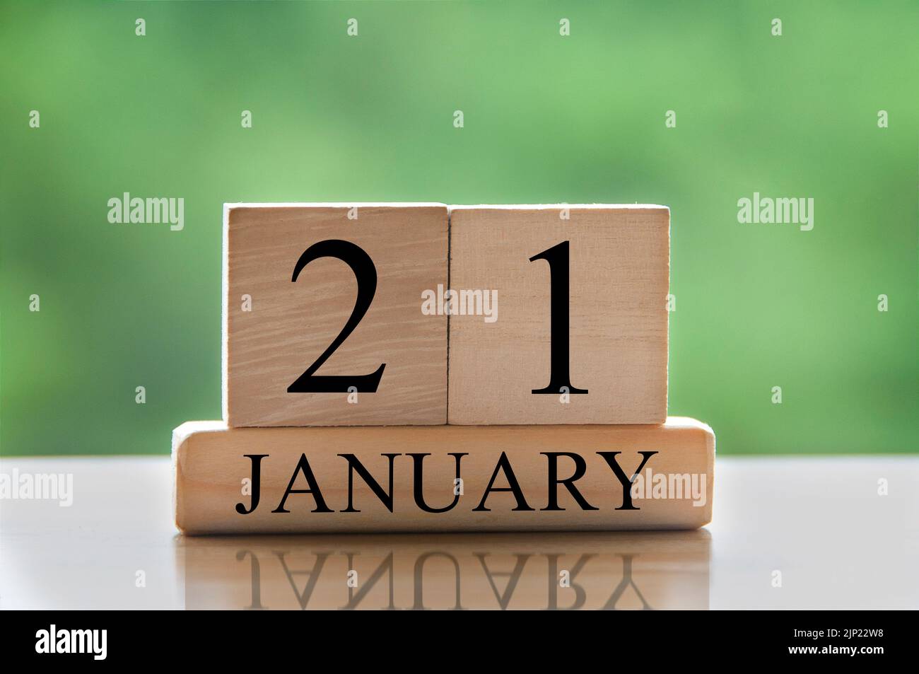 January 21 calendar date text on wooden blocks with blurred background ...