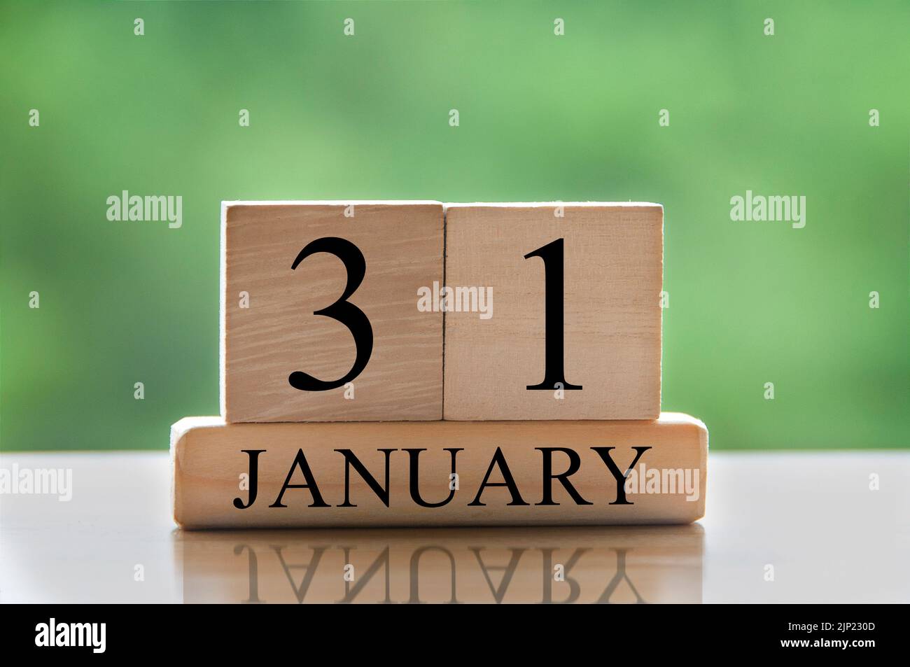 January 31 calendar date text on wooden blocks with blurred background park. Copy space and calendar concept. Stock Photo