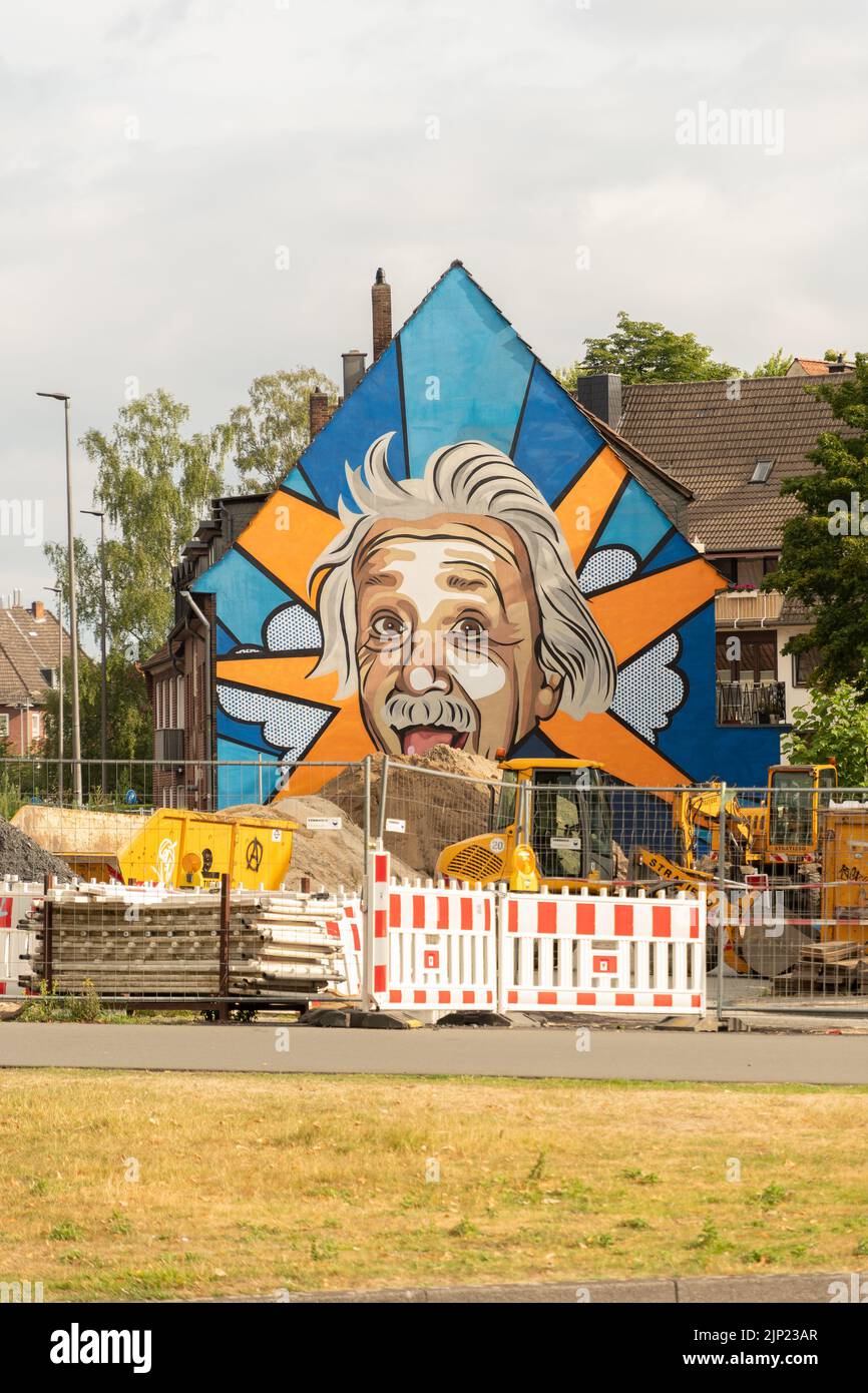 Muenster, Germany, July 9, 2022 Albert Einstein face painted on the facade of a building in the city center Stock Photo