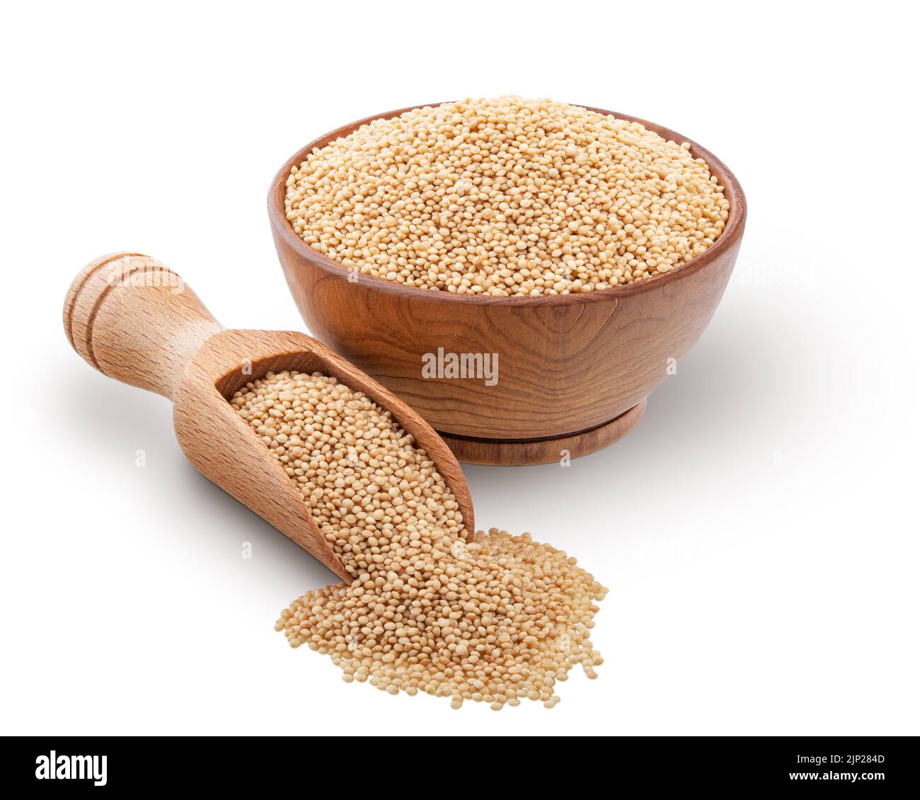 Wooden bowl and scoop full of amaranth seeds isolated on white background. Deep focus Stock Photo