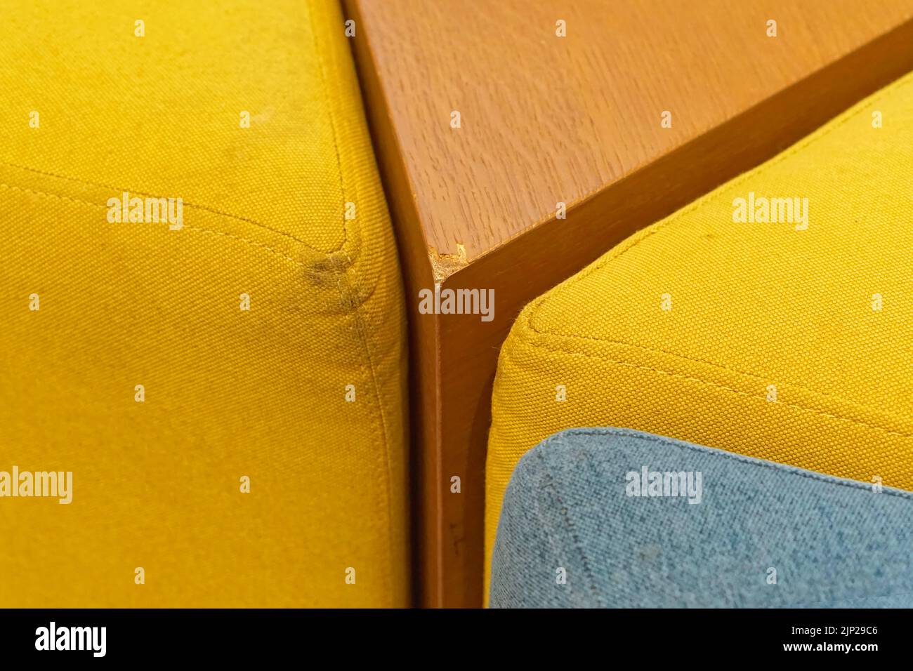 Chipped sharp corner damage at modern wooden furniture Stock Photo