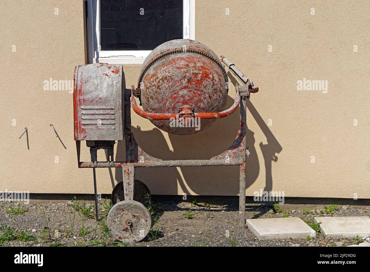 Gas powered concrete cement mixer near new house building Stock Photo Alamy