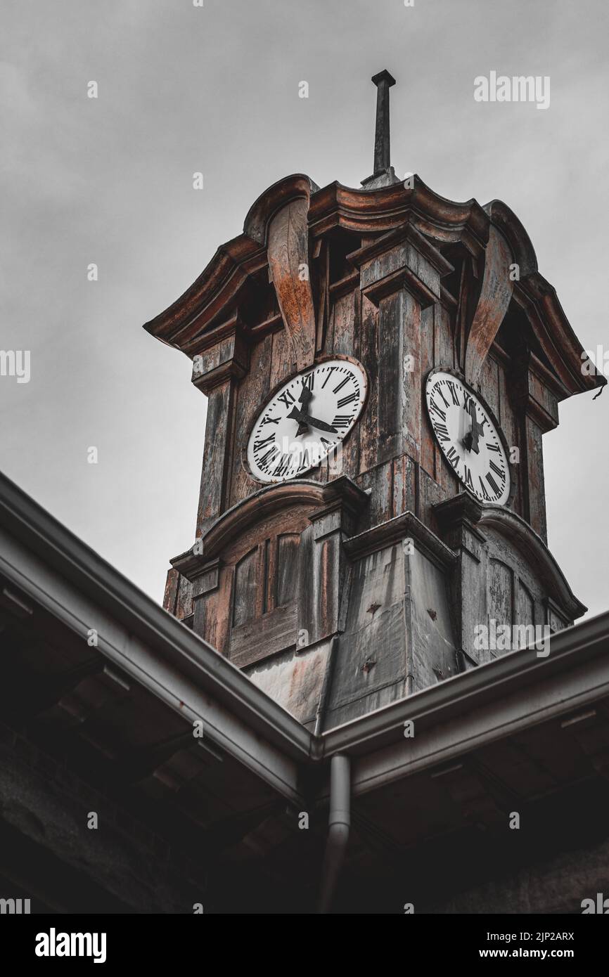 A vertical shot of Muizenberg Railway Station's clock tower. Cape Town, South Africa Stock Photo