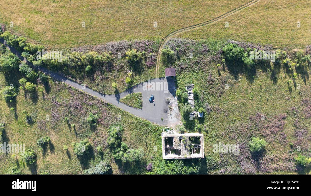 An aerial view of an abandoned building in the field Stock Photo - Alamy