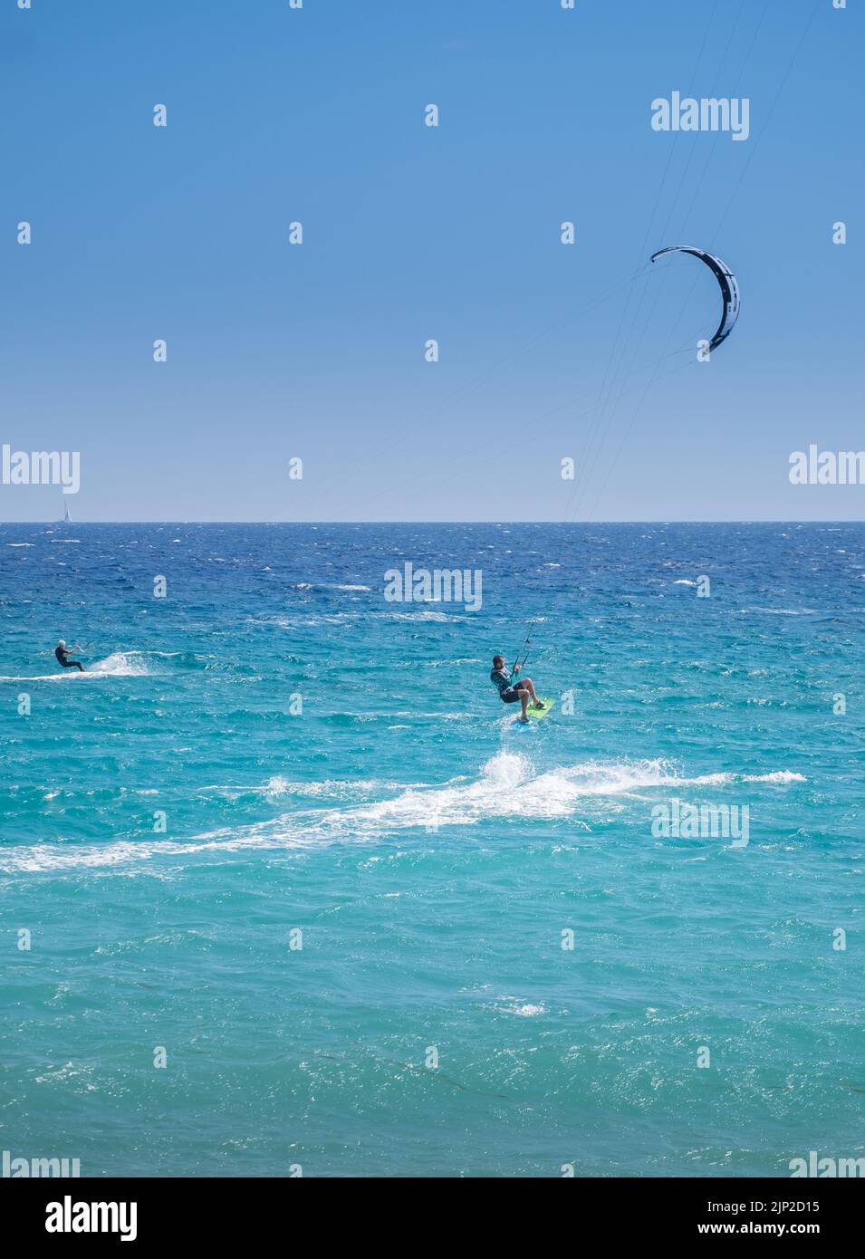 Man kitesurfing and jumping in the Beach of Agiokampos, Greece Stock Photo
