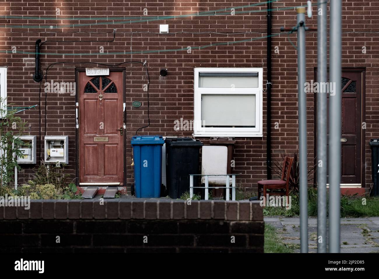 Council Flat in North West England with a cardboard sign above the door reading 'Blighty' Stock Photo
