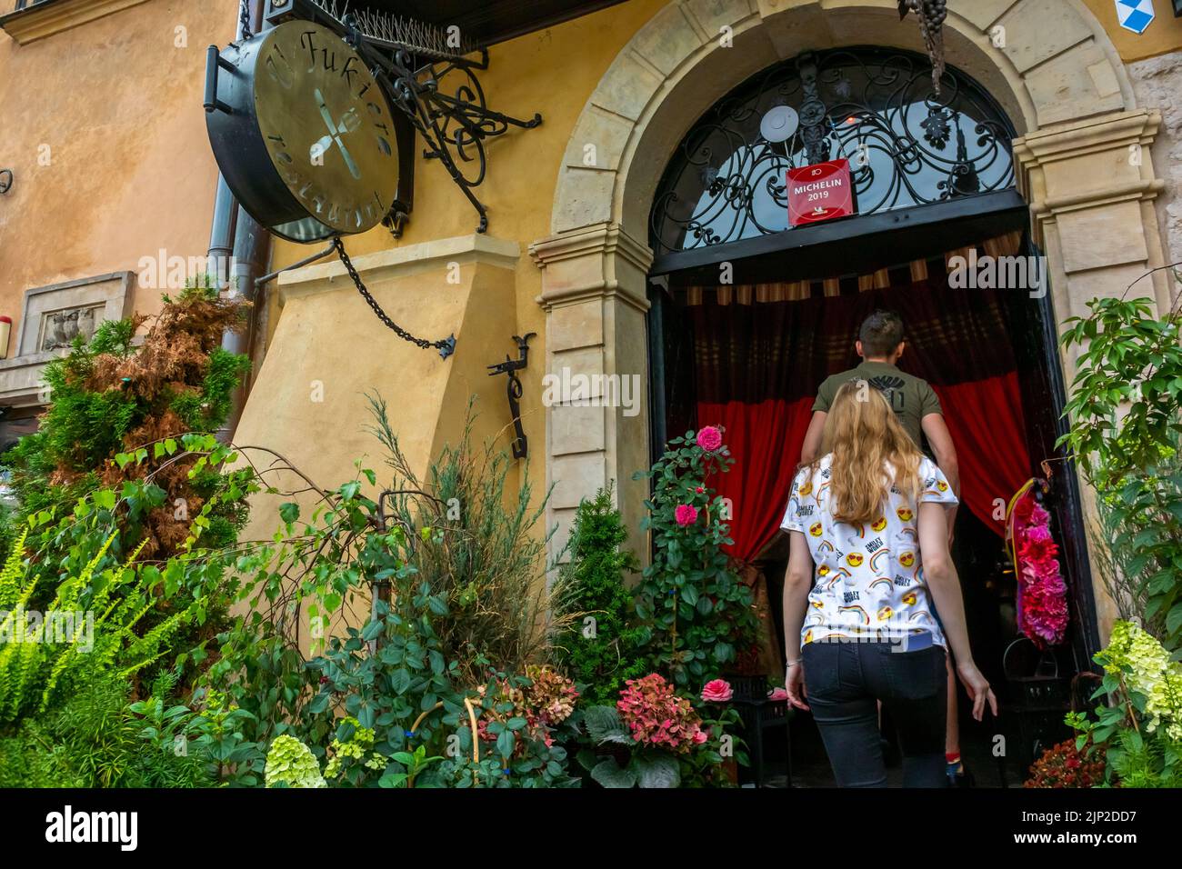 Warsaw, Poland, Tourists Entering Michelin Star Restaurant, U Fukiera, Front Entrance Stock Photo