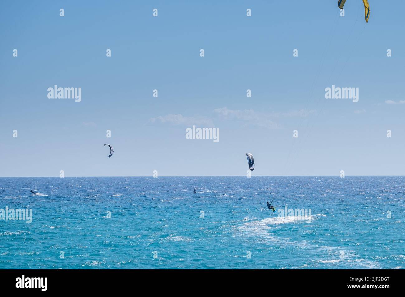 Kitesurfers surfing in the sea of Agiokampos beach, Greece Stock Photo