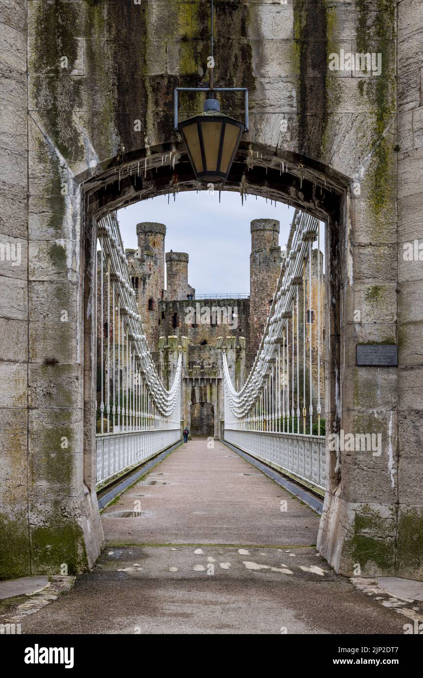 The entrance to the Conwy Suspension Bridge looking towards the castle, Conwy,  Gwynedd, North Wales Stock Photo