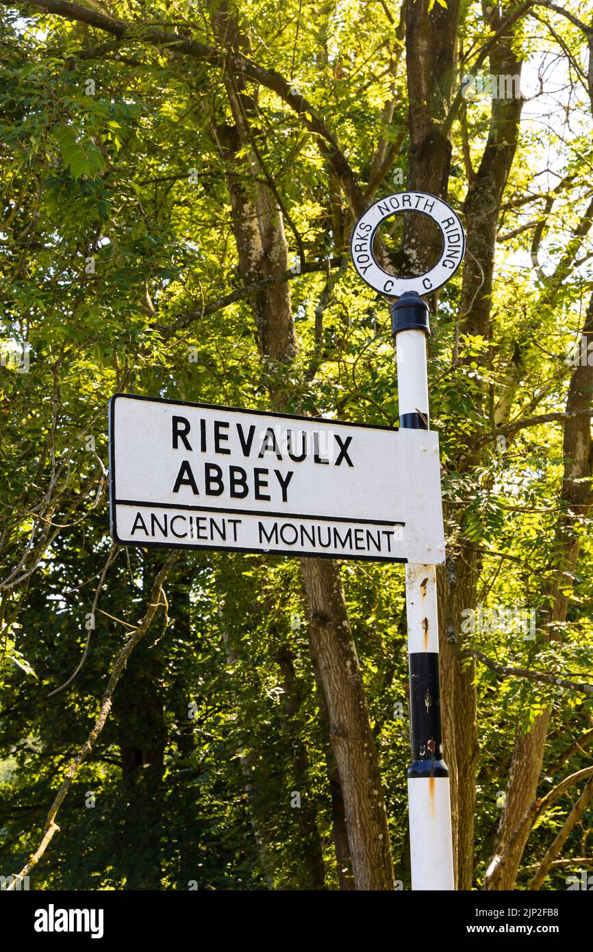 Old Yorks North Riding County council road sign pointing to Rievaulx Abbey, Rye Valley Abbey, ruins near Helmsley, North Yorkshire, England. Stock Photo