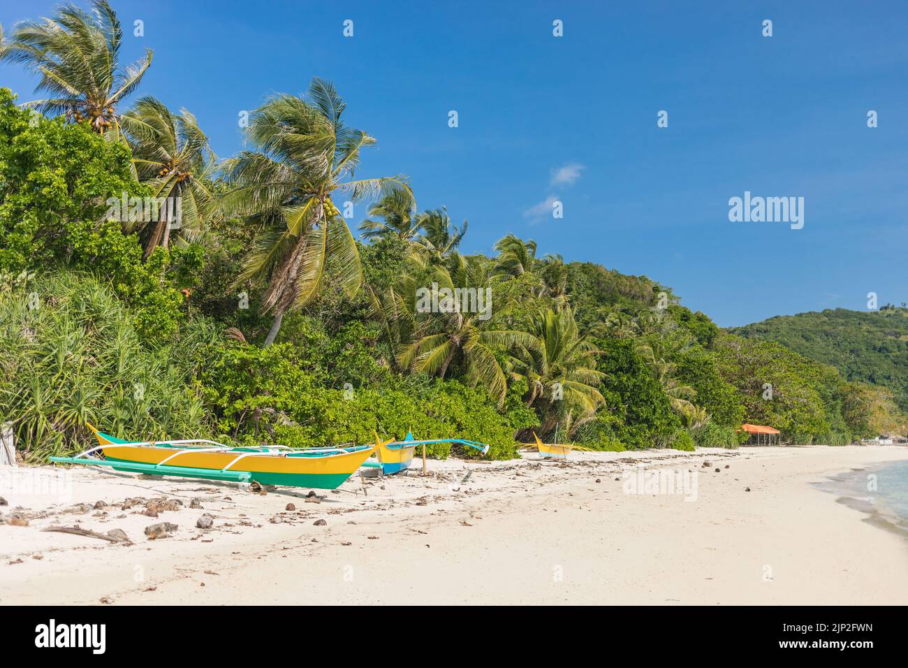 A natural view of wooden boats at the beach of Romblon, Philippines during summer Stock Photo