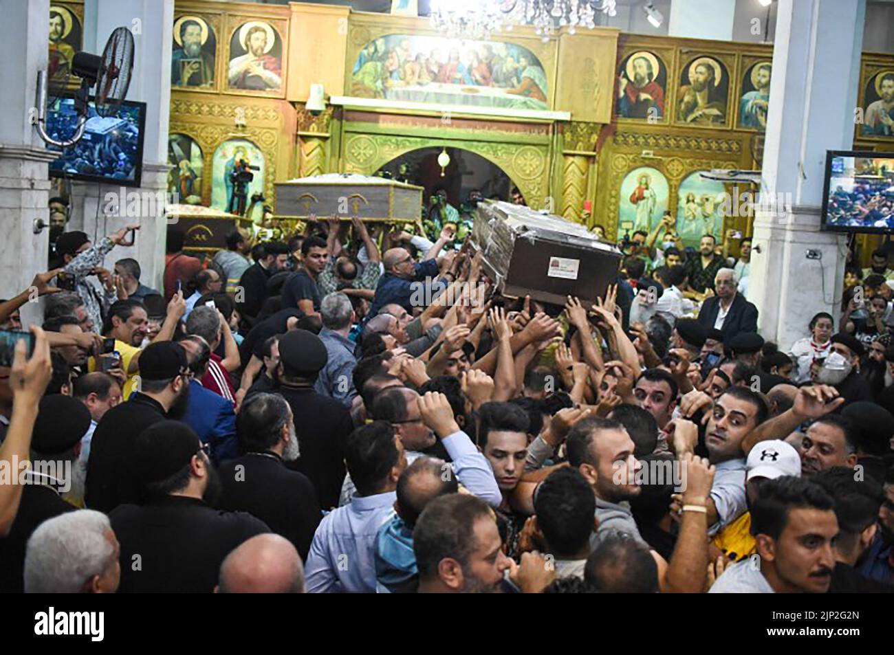 Cairo, Egypt. 15th Aug, 2022. People attend the funeral ceremony for those who lost their lives in the Abu Sefein Church fire at the church of the Blessed Virgin Mary in Giza, Egypt on Sunday on August 14, 2022. A fire tore through a packed Coptic Orthodox church during morning services near Egypt's capital, killing 41 worshippers including at least 10 children. Photo by Sayed Hassan/UPI Credit: UPI/Alamy Live News Stock Photo